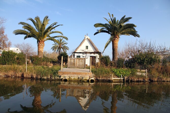 Albufera Private Day Tour: Paella, Boat Cruise and Nature Walk - Stop 2: Gola del Pujol, barracas, and a calmer lake-to-beach walk