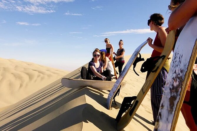 Camel Trekking Dubai with Dune Bashing and Sand Boarding - Sandboarding down the dunes: fun that rewards good stance