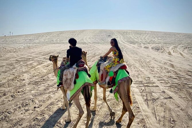 Camel trekking on the Dunes with Sunset - Sealine Beach: falcon photo, Bedouin tea, and that first wow moment