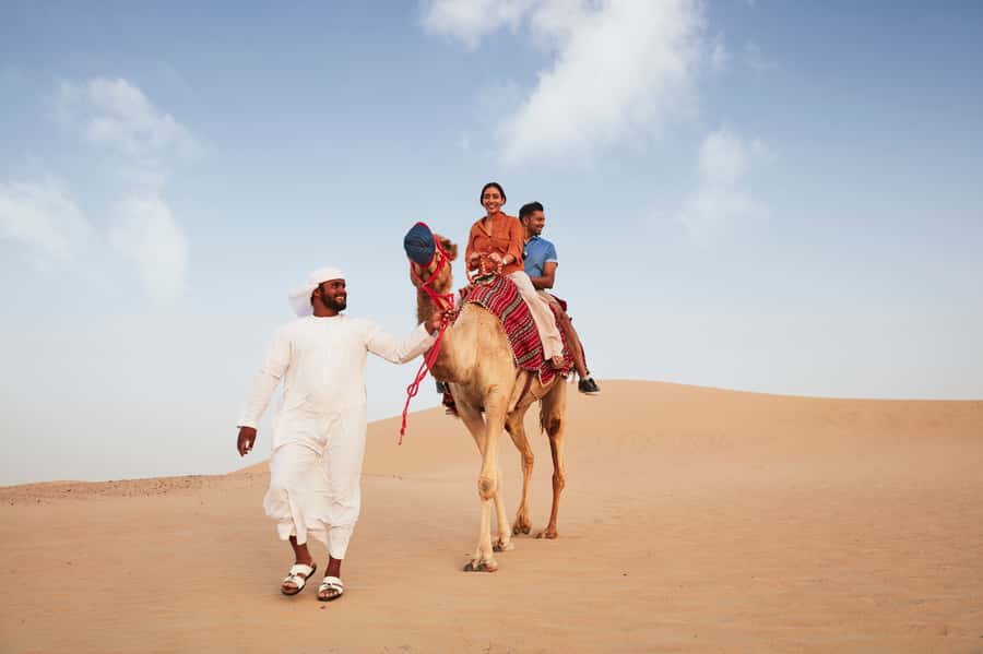 Dubai: Half-Day Camel Trekking with Al Marmoom Breakfast - Dress up for falcon photos: kandura and abaya moments