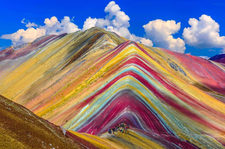 From Cusco: Rainbow Mountain Trek - The hike up: alpacas, llama herds, Ausangate, and red hills