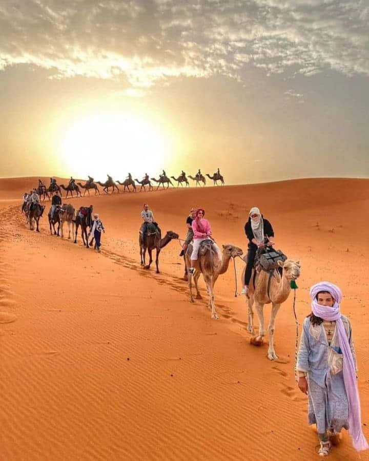 From Merzouga: Overnight Camel Trek over Erg Chebbi Dunes - Day 1 on the dunes: camel trek, sandboarding, and the rhythm of a Berber welcome