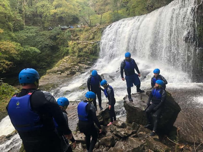 Neath: Canyoning, Gorge Walking & Waterfall Trekking Tour - Walking Under Waterfalls and Sliding Down Natural Rock