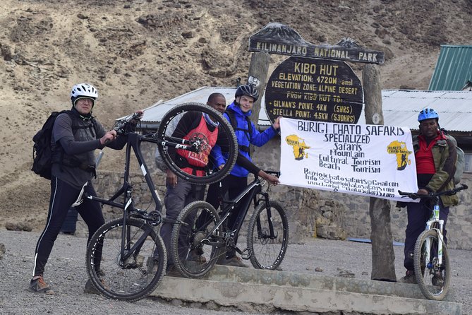 Top 6 Days Mt. Kilimanjaro Bike trek Tour by Marangu-Kilema Route - Day 5: 4am climb, Hans Meyer’s Cave, Gilman’s Point, and the ride to Uhuru
