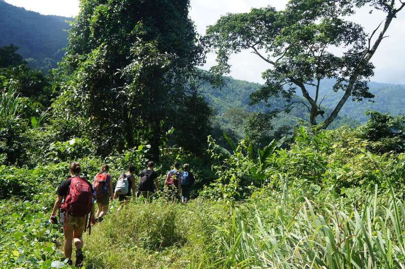 Vang Vieng: Jungle & Caves Full-Day Private Trekking Tour - Climbing the ridgeline for panoramic views of Vang Vieng